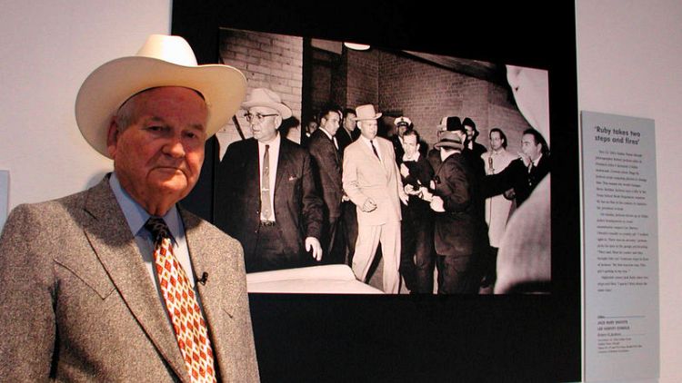 Former Dallas detective famously photographed escorting Lee Harvey Oswald dies at 99