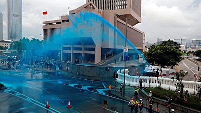 Hong Kong police fire tear gas as march turns into violent chaos Hong Kong police fire tear gas as march turns into violent chaos