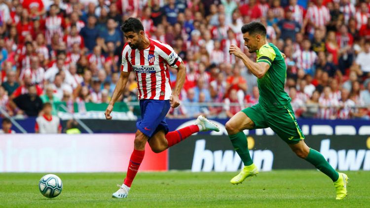 Atletico fight back to sink Eibar for third win
