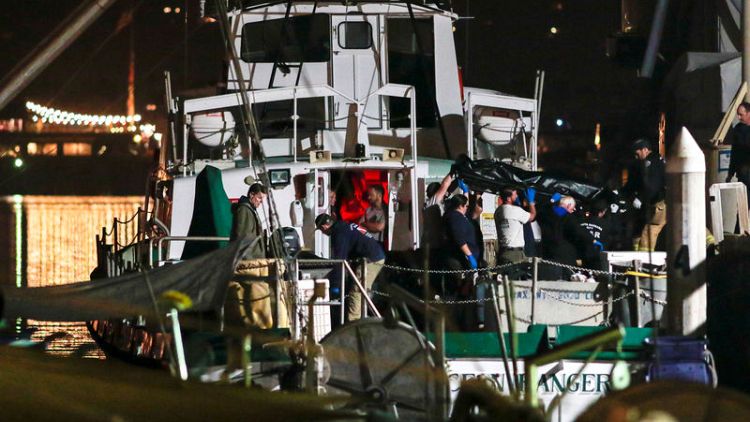 Divers search for last bodies in California boat fire, investigations begin