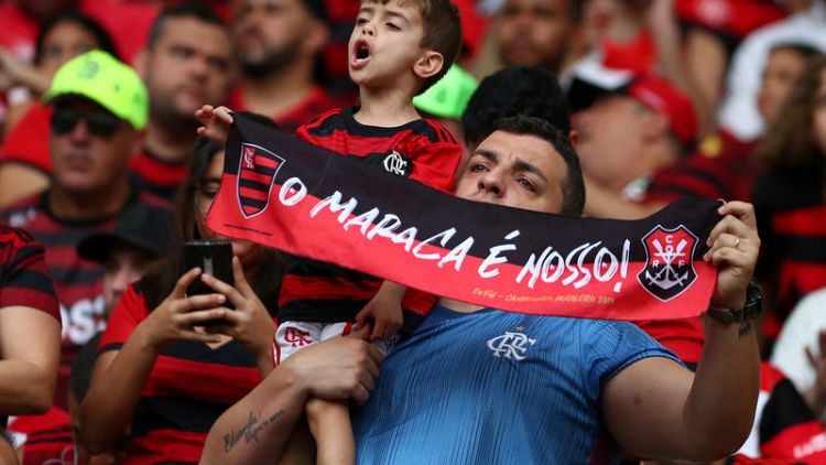 Soccer - Brazilian fans ignore foul play as crowds soar