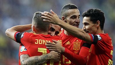 Spain survive Romania onslaught to secure fifth win