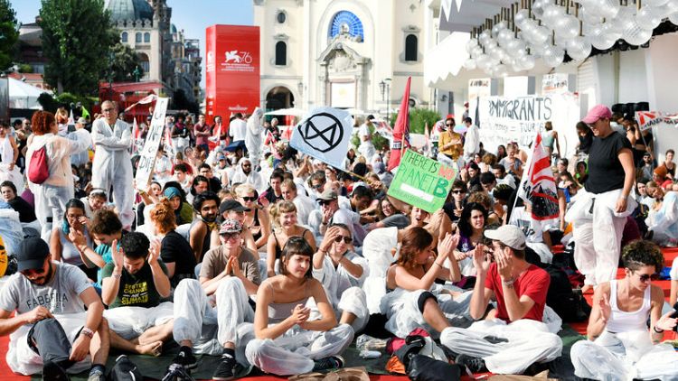 Climate change activists storm red carpet at Venice Film Festival