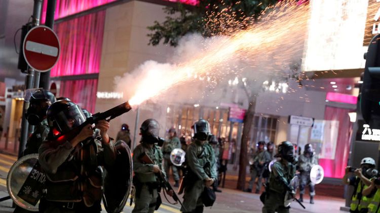 Hong Kong police fire tear gas as clashes erupt after thousands appeal to Trump