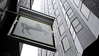 Lloyds ups PPI provisions to 1.2-1.8 billion sterling, suspends buyback