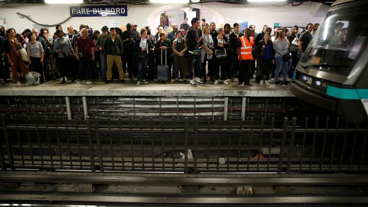 Paris commuter chaos as metro workers strike over pension reform