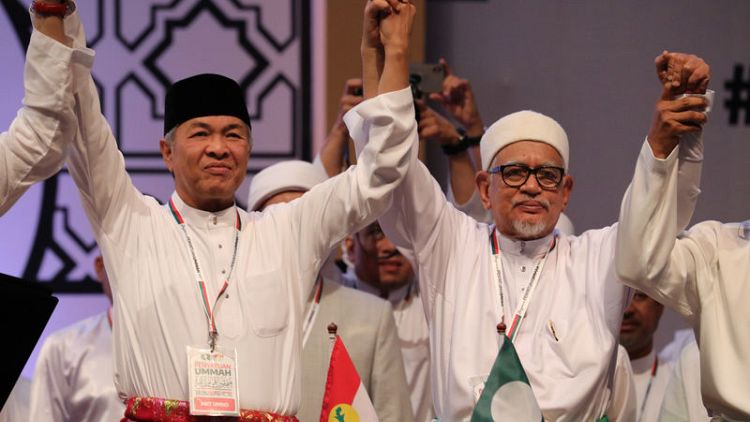 In push for race and religion, Malaysian opposition formalises pact