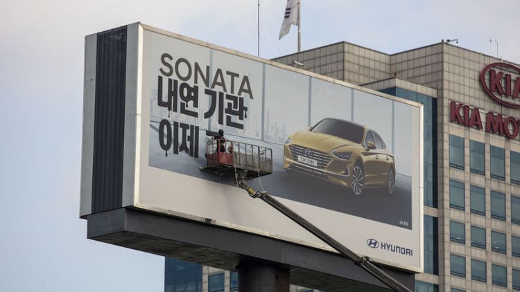 Greenpeace posts protest sign over Hyundai billboard in South Korea