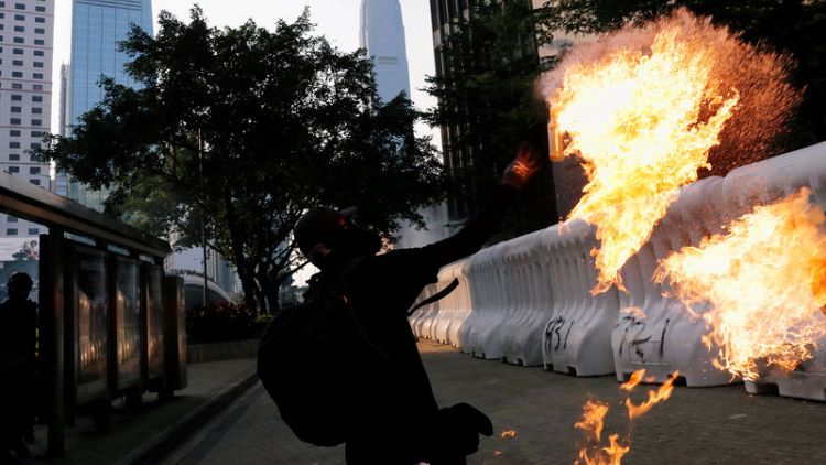 Hong Kong reopens after violent weekend of clashes and protests
