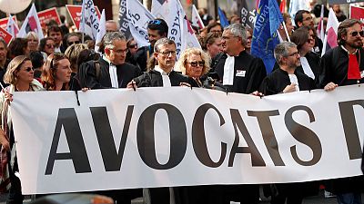 Doctors, lawyers and pilots protest in Paris over pension reforms