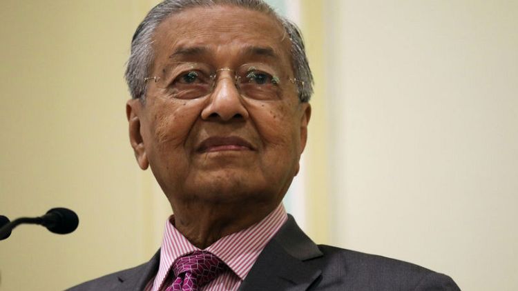 Malaysia PM suggests law to force companies to stop fires abroad