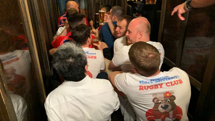 Japanese and Russian fans party before World Cup opener