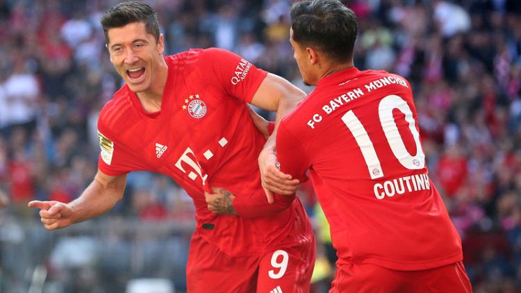 Lewandowski double as Bayern crush Cologne to go top