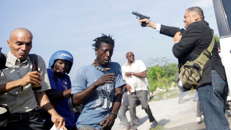 Haiti legislator fires handgun at protest, photojournalist injured
