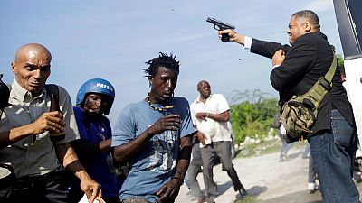 Pistol-packing senators confront Haiti's angry opposition