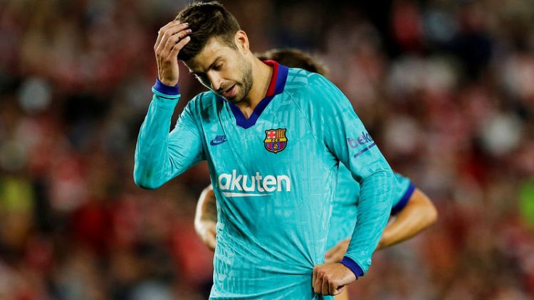 Pique blames pre-season tour for Barca's slow start