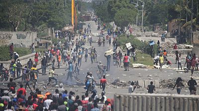 Haitian police use tear gas, live ammunition to break protests