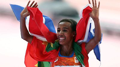Hassan takes 10,000m world title with late surge