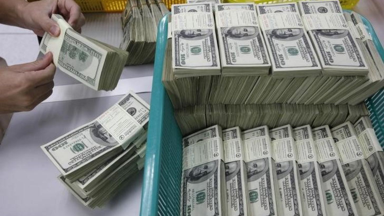 Dollar pinned down after poor U.S. manufacturing data; pound slips