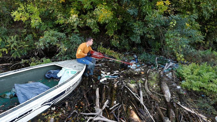 Hungarian wages one-man campaign against floating garbage in river