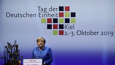 Merkel warns against racism on anniversary of German reunification