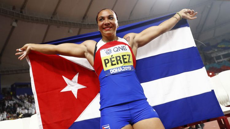 Athletics: Cuba's Perez rewarded for persistence with discus gold