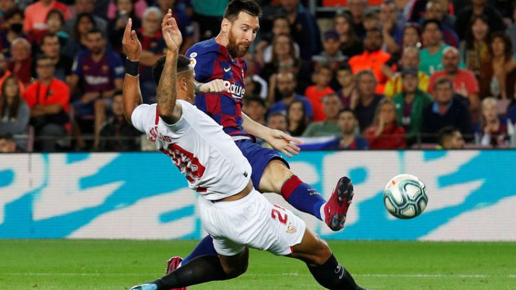 Ruthless Barca thrash Sevilla but have two players sent off
