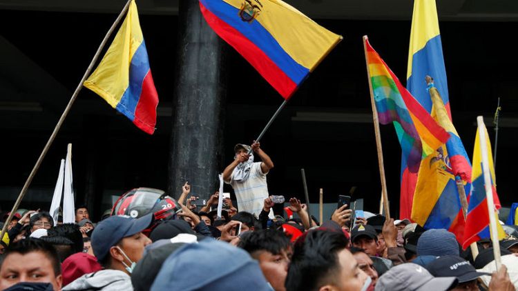 Ecuador imposes curfew after protests push government out of capital