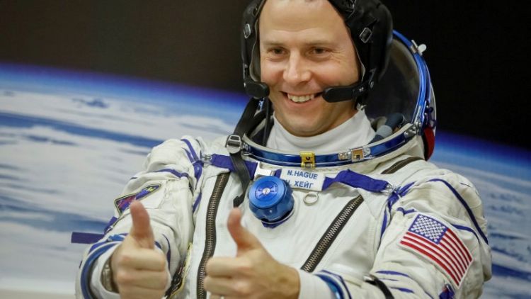 Putin bestows award for courage on U.S. astronaut who survived rocket failure