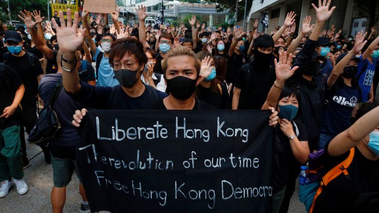 Hundreds of black-clad activists chant 'Liberate Hong Kong' outside High Court