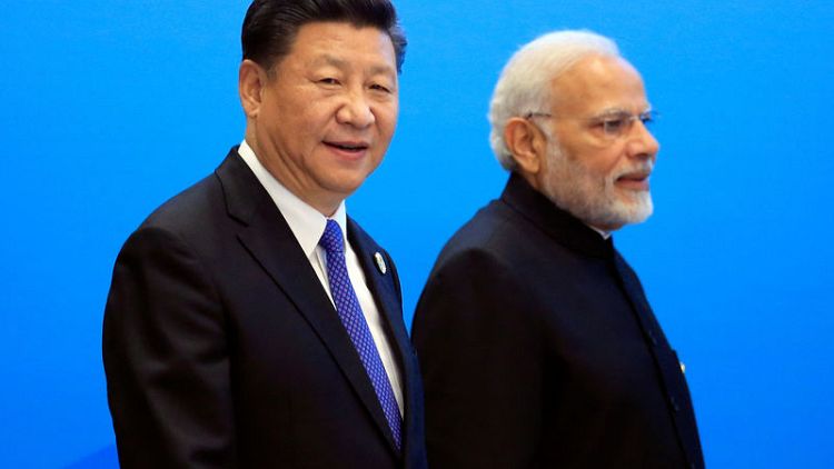 India's Modi to host China's Xi at summit with ties strained by Kashmir
