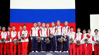 Russia's men edge China to claim maiden team title at worlds Russia's men edge China to claim maiden team title at worlds