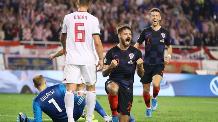 Croatia thump Hungary to stay on course, Slovakia hold Wales