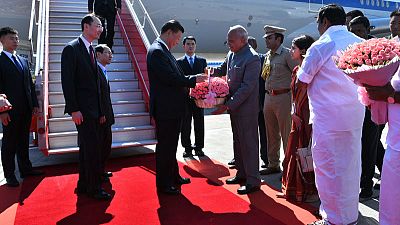 China's Xi lands in India amid scattered Tibetan protests China's Xi lands in India amid scattered Tibetan protests