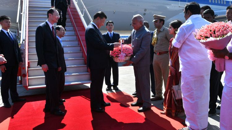 China's Xi lands in India amid scattered Tibetan protests