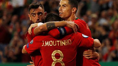 Portugal and Ukraine close in on Euro 2020 with home wins Portugal and Ukraine close in on Euro 2020 with home wins