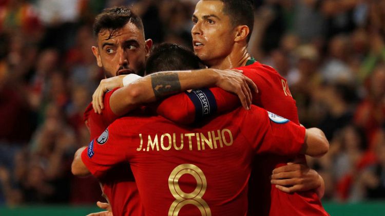 Portugal and Ukraine close in on Euro 2020 with home wins