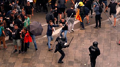 Spain jails Catalan separatist leaders, sparking protests, clashes