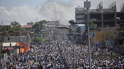 Singing and dancing, Haitians flock to streets in anti-government protest Singing and dancing, Haitians flock to streets in anti-government protest