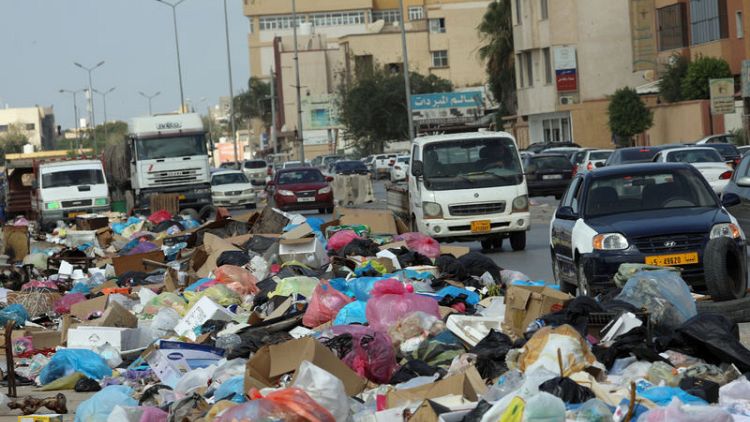 Libyan conflict leaves rubbish mounds smouldering in Tripoli's streets