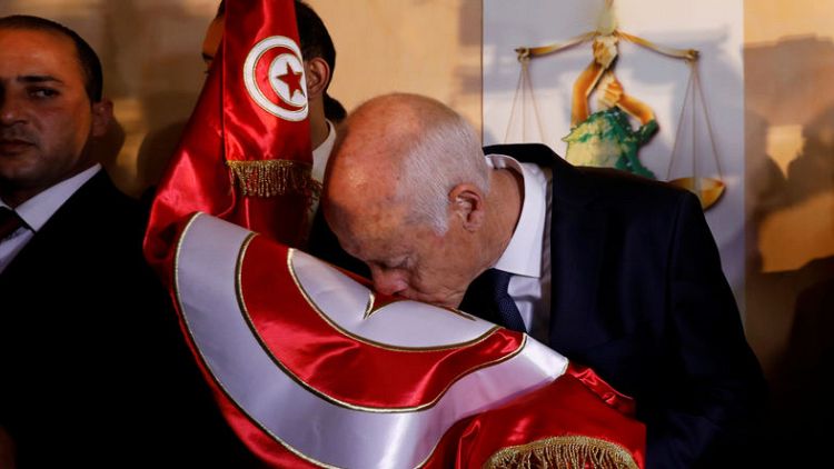 Saied supporters hail revival of Tunisia's 2011 revolution after poll