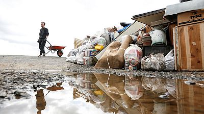 Rescuers slog through mud as Japan typhoon death toll rises to 66 Rescuers slog through mud as Japan typhoon death toll rises to 66