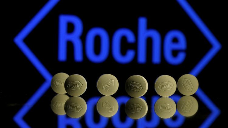 Roche boosts 2019 sales outlook, sees Spark deal this year