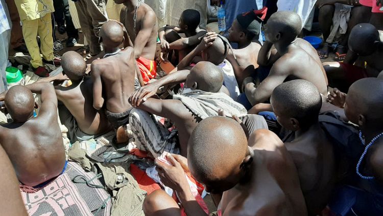 Police free hundreds of males, some chained and beaten, from Nigerian school in third raid this month