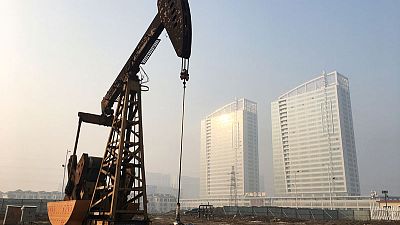 Oil prices fall on signs of large U.S. stock build Oil prices fall on signs of large U.S. stock build