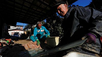 Abe visits typhoon-hit areas; Japan may postpone new emperor's parade Abe visits typhoon-hit areas; Japan may postpone new emperor's parade