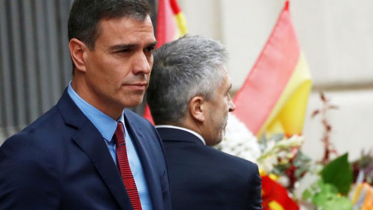 Spanish PM visits Barcelona, criticises regional chief