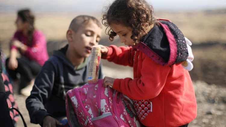 Uprooted by war, Kurdish families stuck at Syria-Iraq border crossing