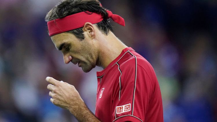 Federer wins in 53 minutes to advance in Basel in 1,500th tour game