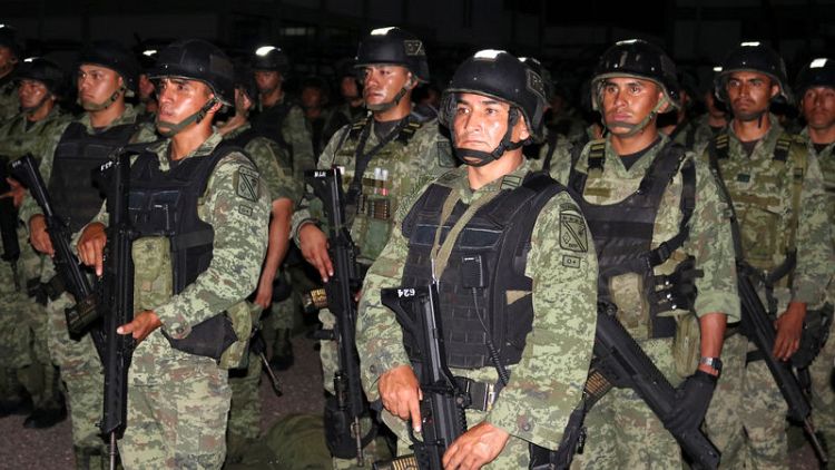 Mexico sends in elite troops to patrol city after cartel battle